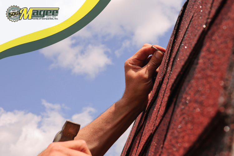 Roofer replacing damaged shingles on a Farmington roof repair project